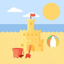 a sandcastle, a ball and a bucket on a beach