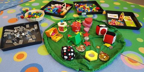 Play blocks and cubes on floor mats