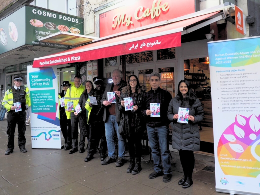 Cllrs, police and council officers, with My Caffe owner outside My Caffe