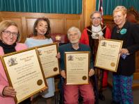 The Worshipful Mayor of Barnet, Councillor Tony Vourou, gives the Councillors their Long Service Awards.